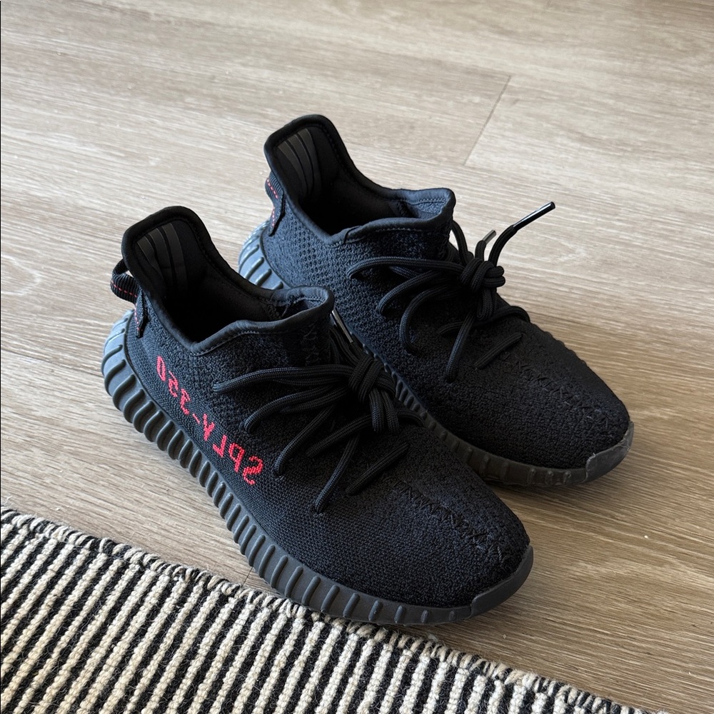 Adidas Black Yeezy Sneakers with Red Accents